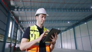 Customs officer using a tablet device